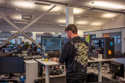 Employee working at a standing desk